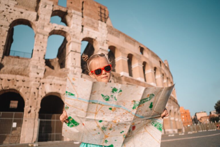 Little girl in front of colosseum in Rome, Italy